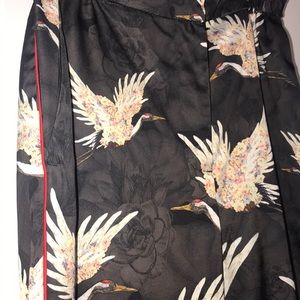 Bird floral detailed pants with red stripe